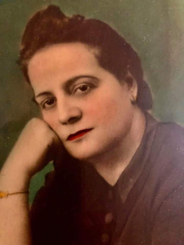 A hand-tinted, mid-twentieth century photograph of Dorothea Kaloumenos, subject of the poem and the poet’s grandmother.